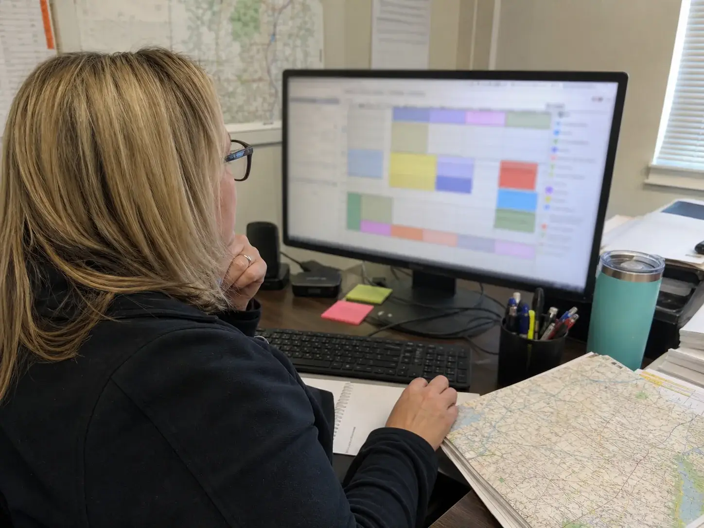 Service dispatcher reviewing appointment windows and travel gaps